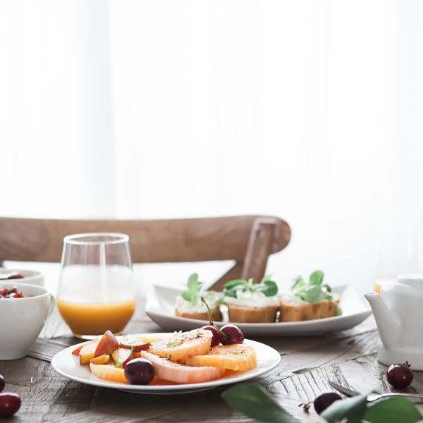 brooke-lark-otyxnXPBtOQ-unsplash Table with food on it