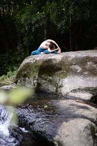 Woman stretching by river